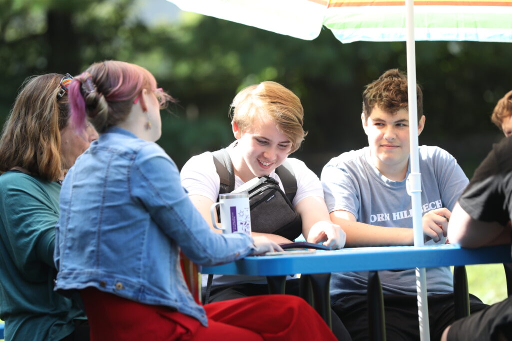 middle school students enjoy some time together outside